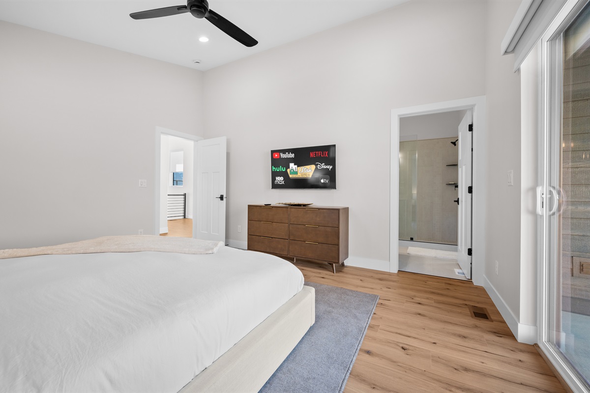 Unwind in the luxurious Primary Bedroom with King bed, Smart TV, and spa-like ensuite bath.