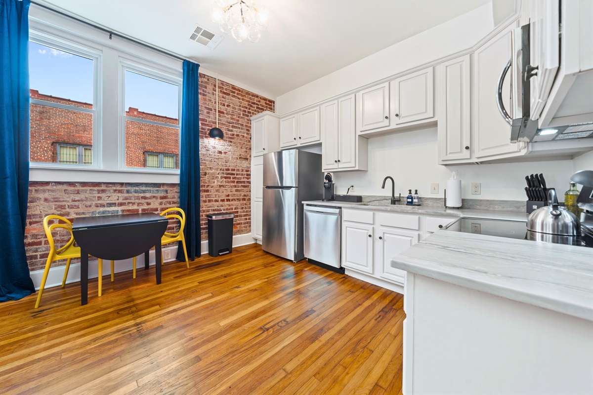 The open kitchen layout with modern appliances creates a welcoming space for meal prep and enjoying homemade dishes.