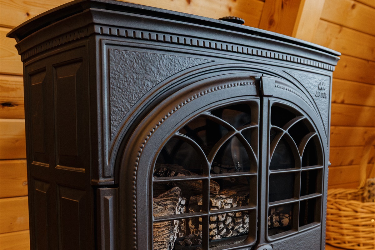 Freestanding natural gas fireplace (currently not operational). This fireplace is not needed for heat, and a replacement is in progress.