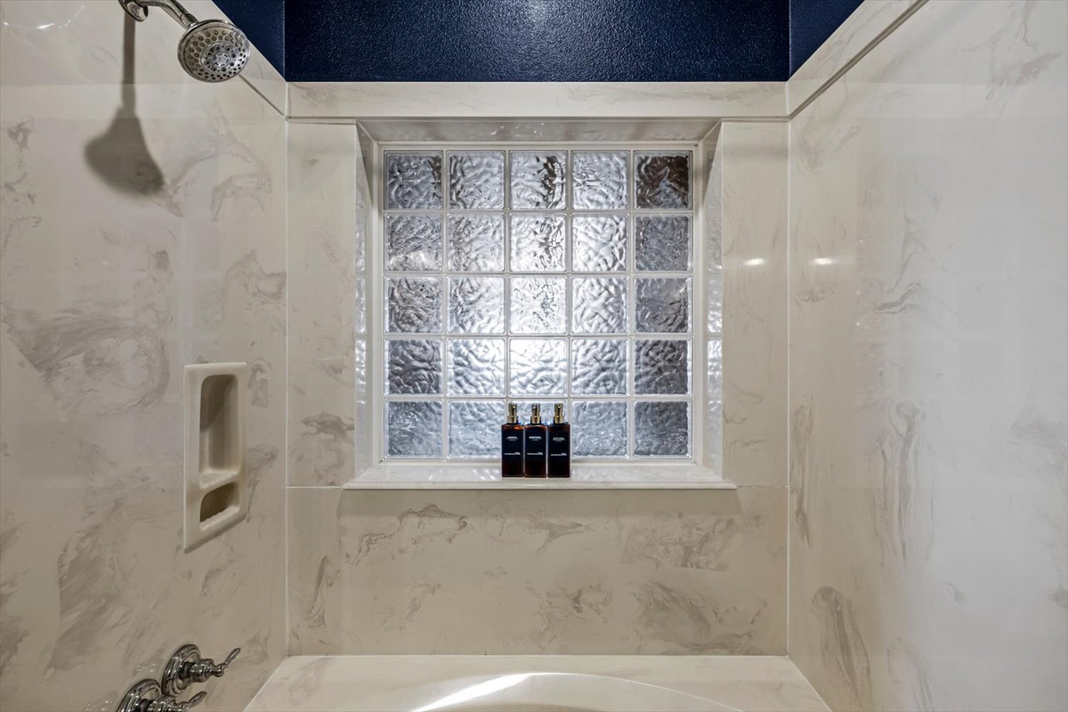 Extra large tub shower combination is versatile for all needs.