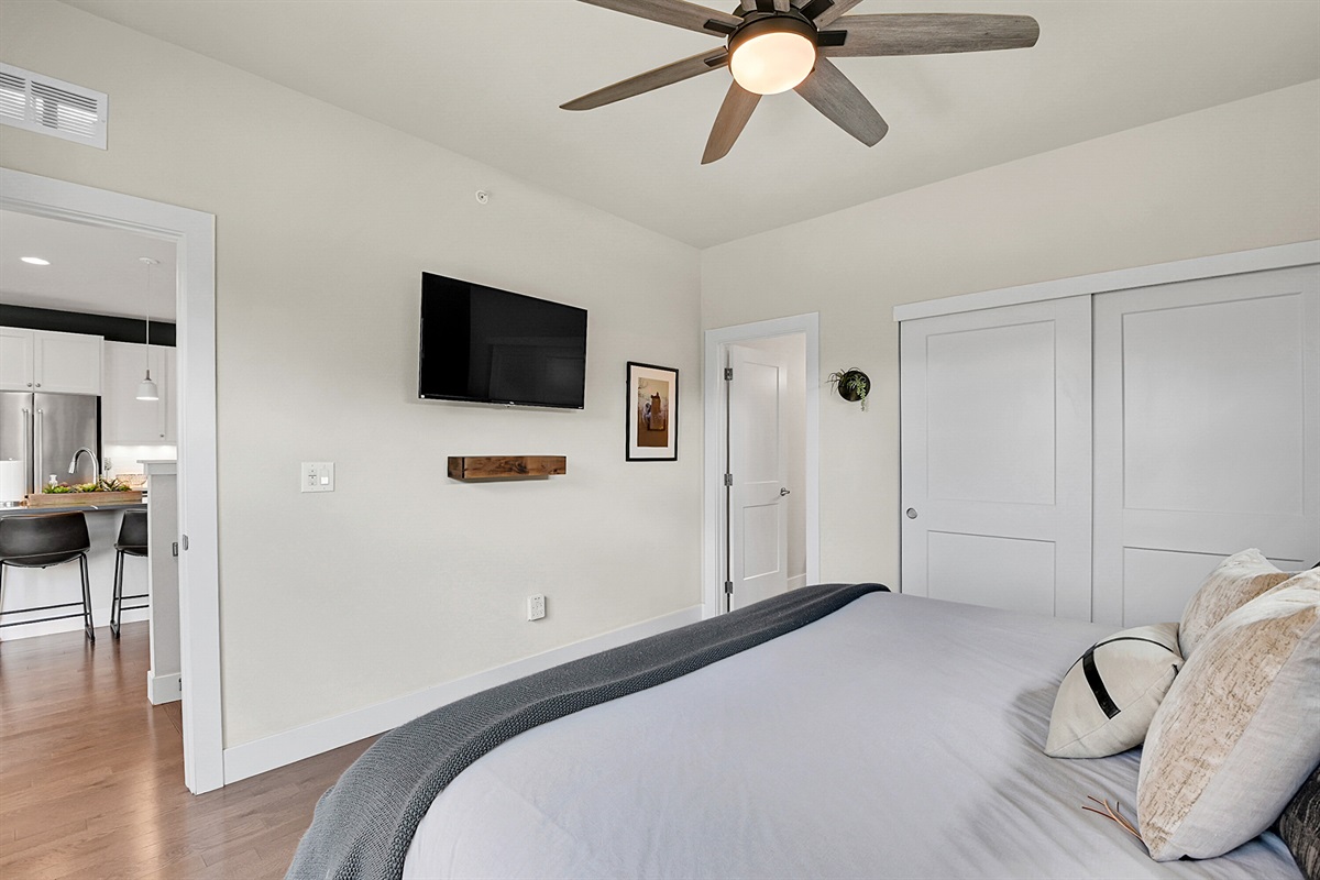 Wood Bedroom showing full-size TV