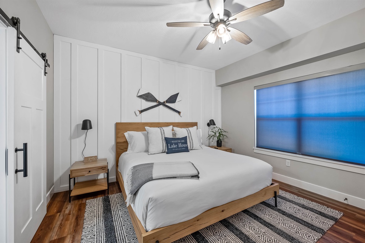 Main level King #1 with attached bath. This bathroom is also the main bathroom for guests on this floor with an entrance from the bedroom and also entrance from the main hall.