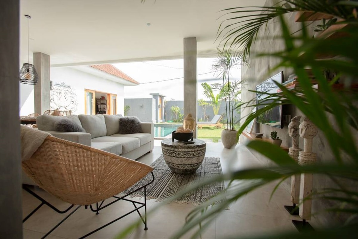A view of the garden from the living room, bathed in natural light.