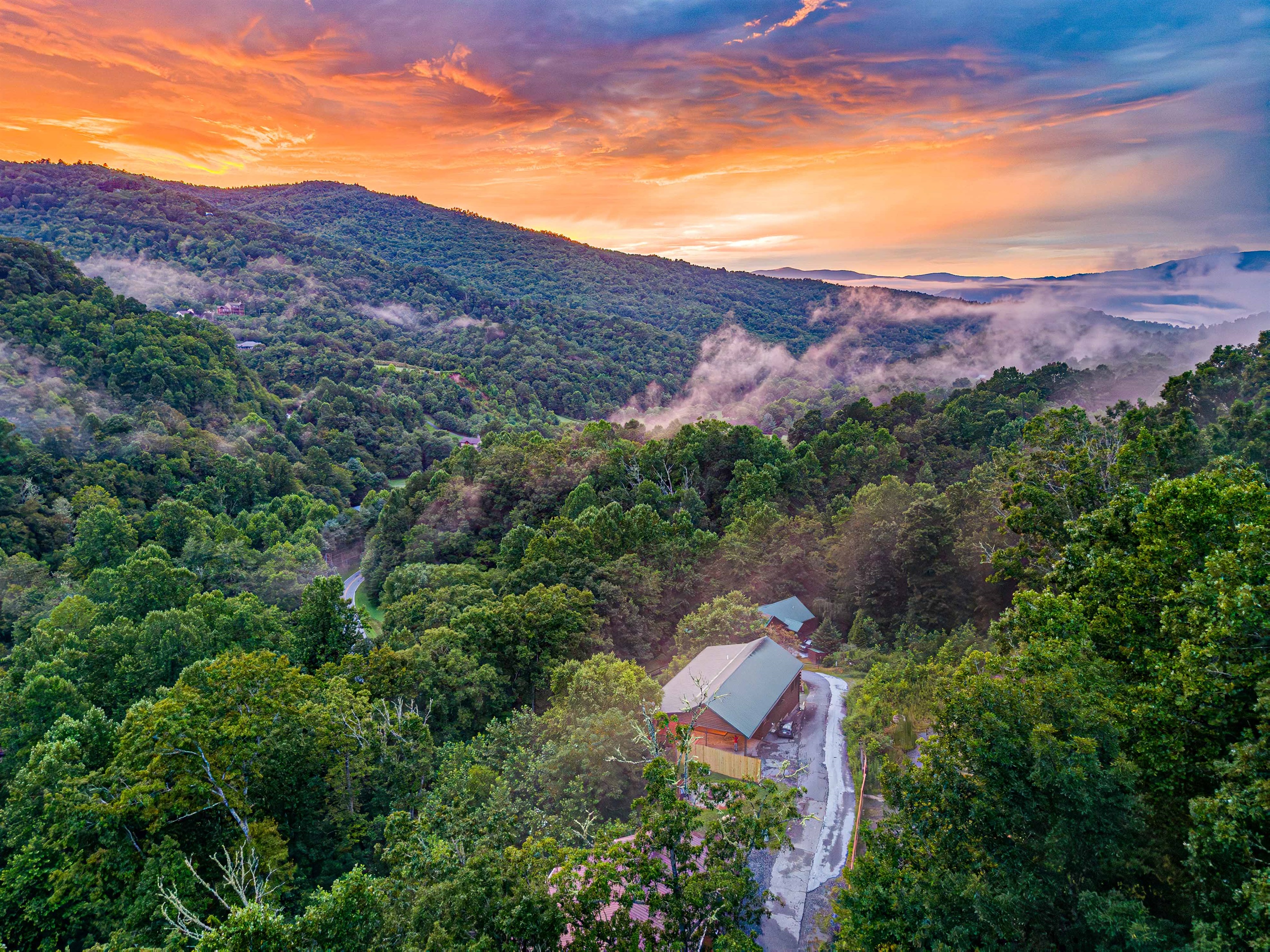 Mountaintop Retreat: Enjoy stunning sunsets from your secluded cabin.