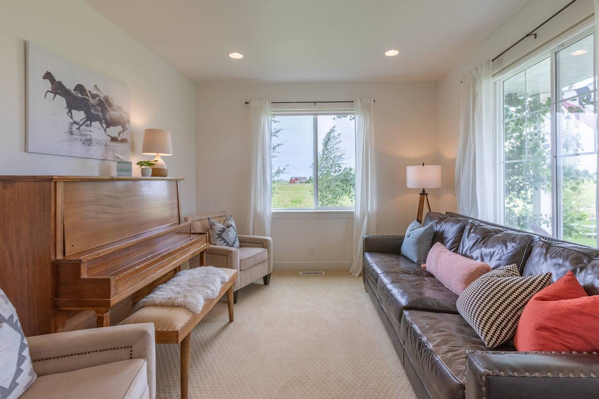 Comfortable sitting room just off the entry—relax and enjoy the peaceful vibe