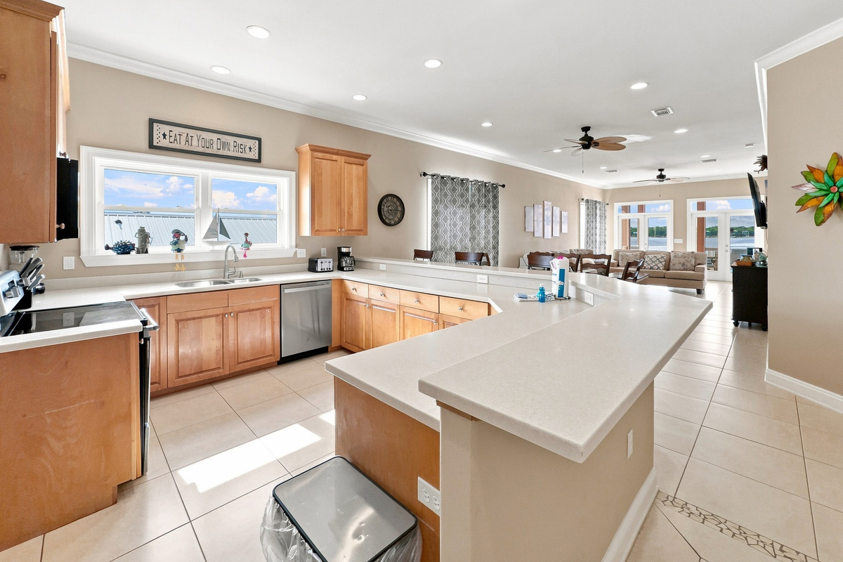 Large kitchen with a center island, open to the living space