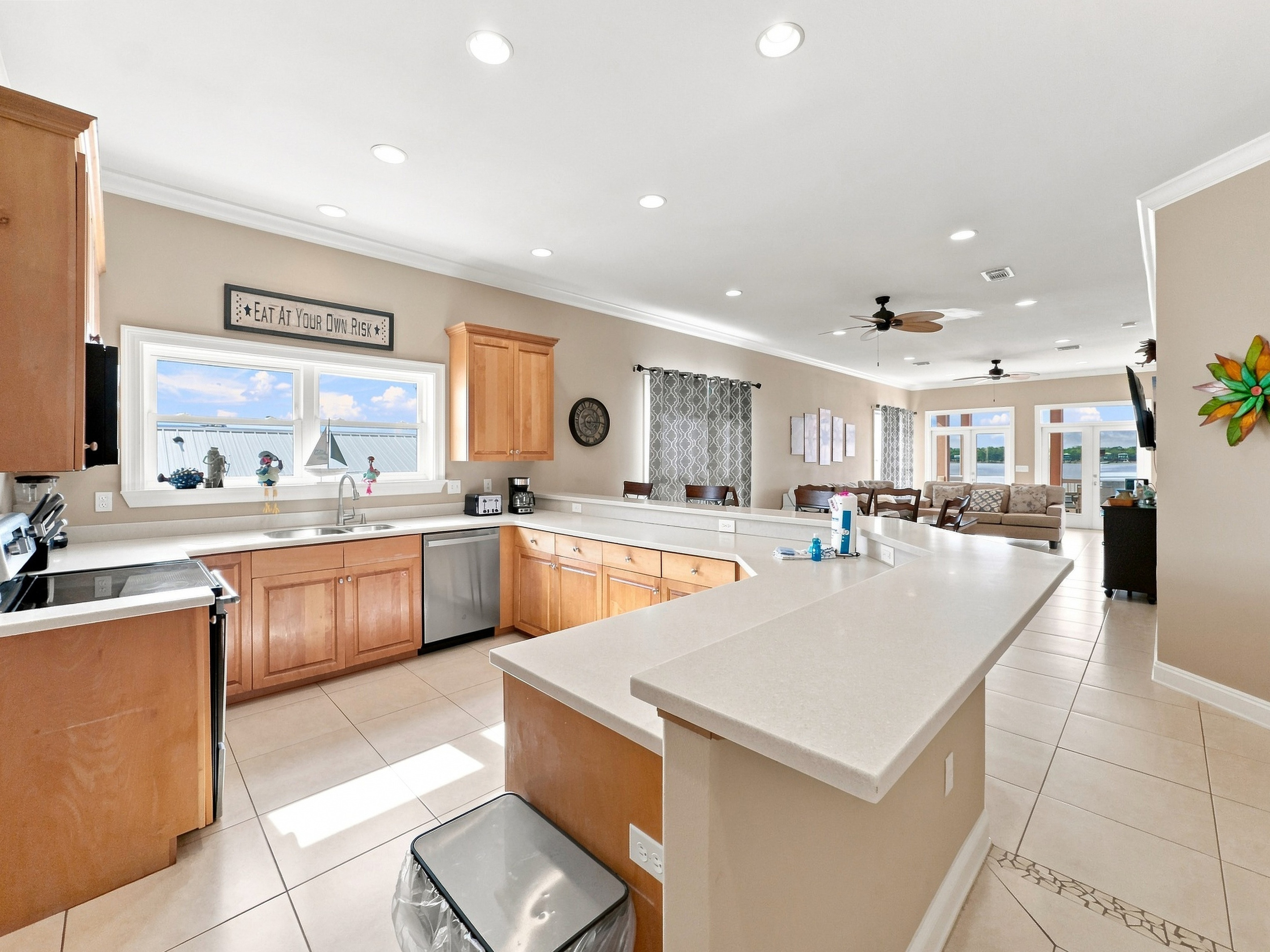 Large kitchen with a center island, open to the living space