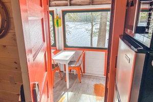 view from inside of the cabin to the indoor dining