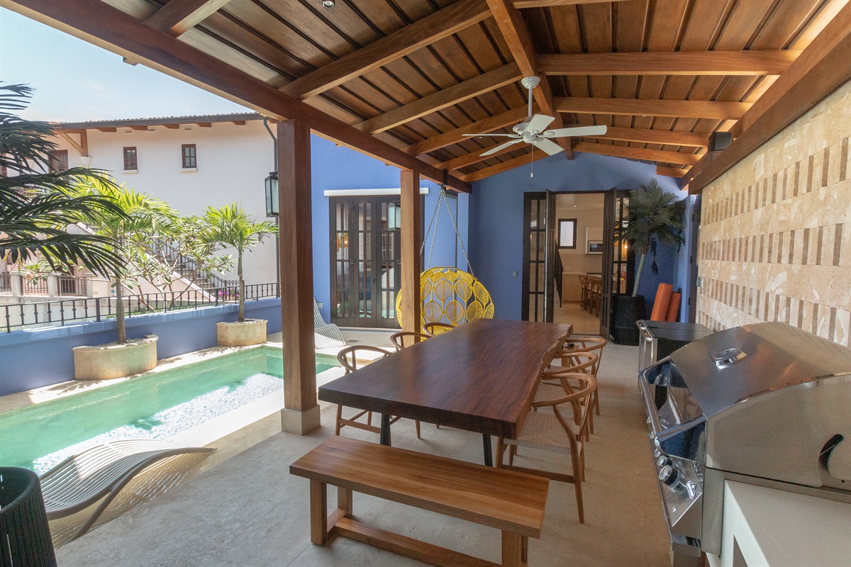 Stunning private pool with an open flow to the left wing of the home with kitchen, living, and secondary bedrooms upstairs.