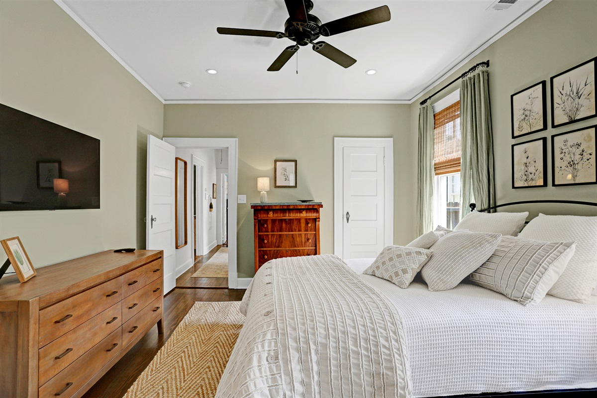 This inviting bedroom offers a quiet escape, blending comfort and understated elegance.
