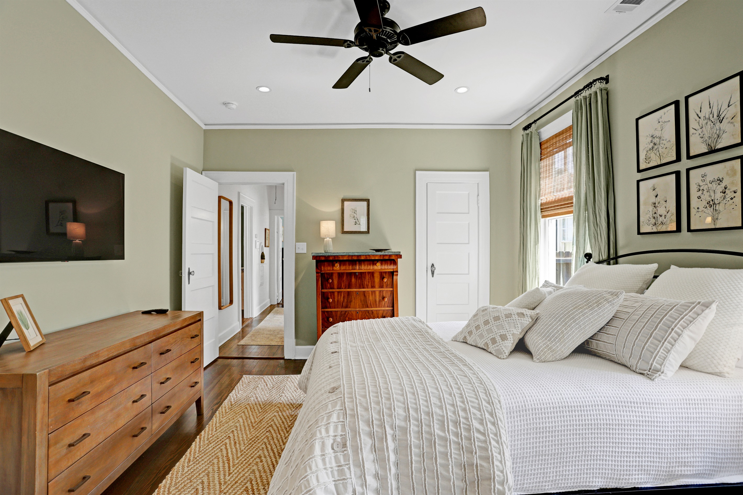 This inviting bedroom offers a quiet escape, blending comfort and understated elegance.