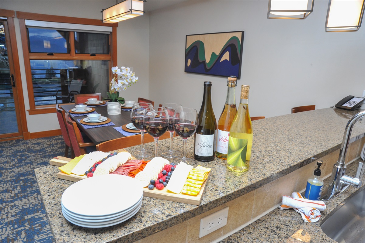 Bar area and open dining room. Dining table seats 6, bar area seats 3