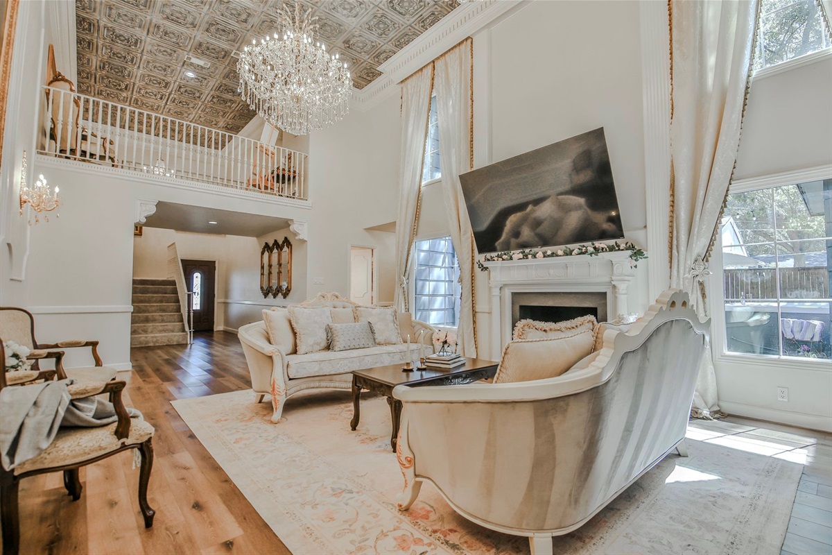 Where chandeliers sparkle and stories unfold—this elegant salon pairs timeless charm with lofty grandeur.