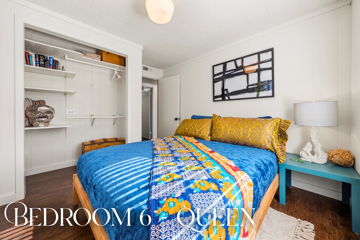 Unwind in this queen bedroom where natural light, soft linens, and a calming design make it easy to fully relax.