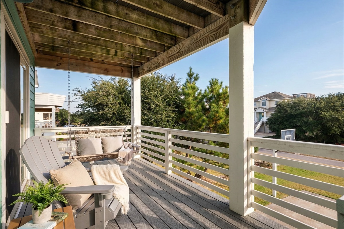 Serene covered porch with peaceful views, ideal for sipping morning coffee.