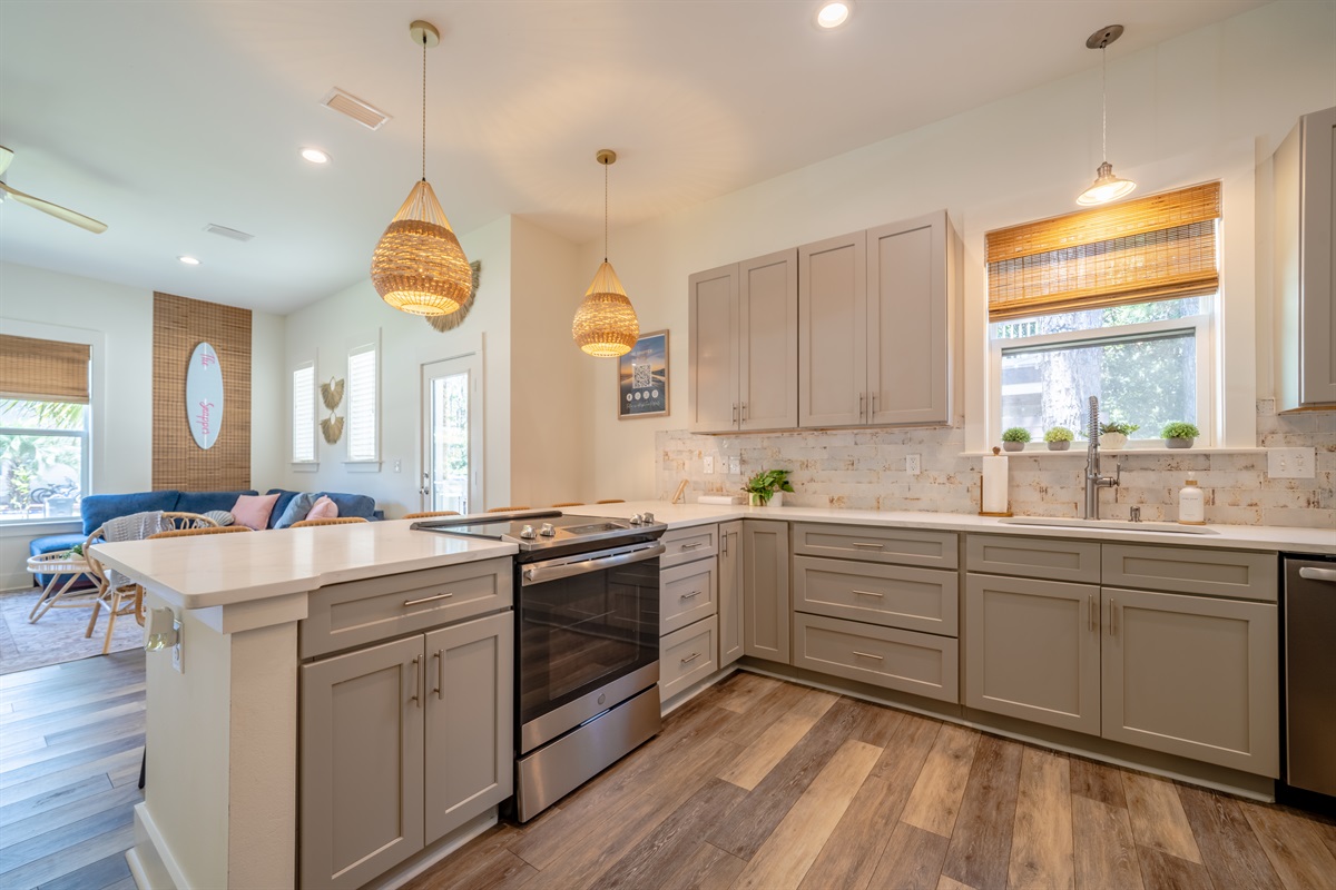 Bright, spacious kitchen with a large island perfect for cooking and gathering — fully equipped for all your culinary adventures!