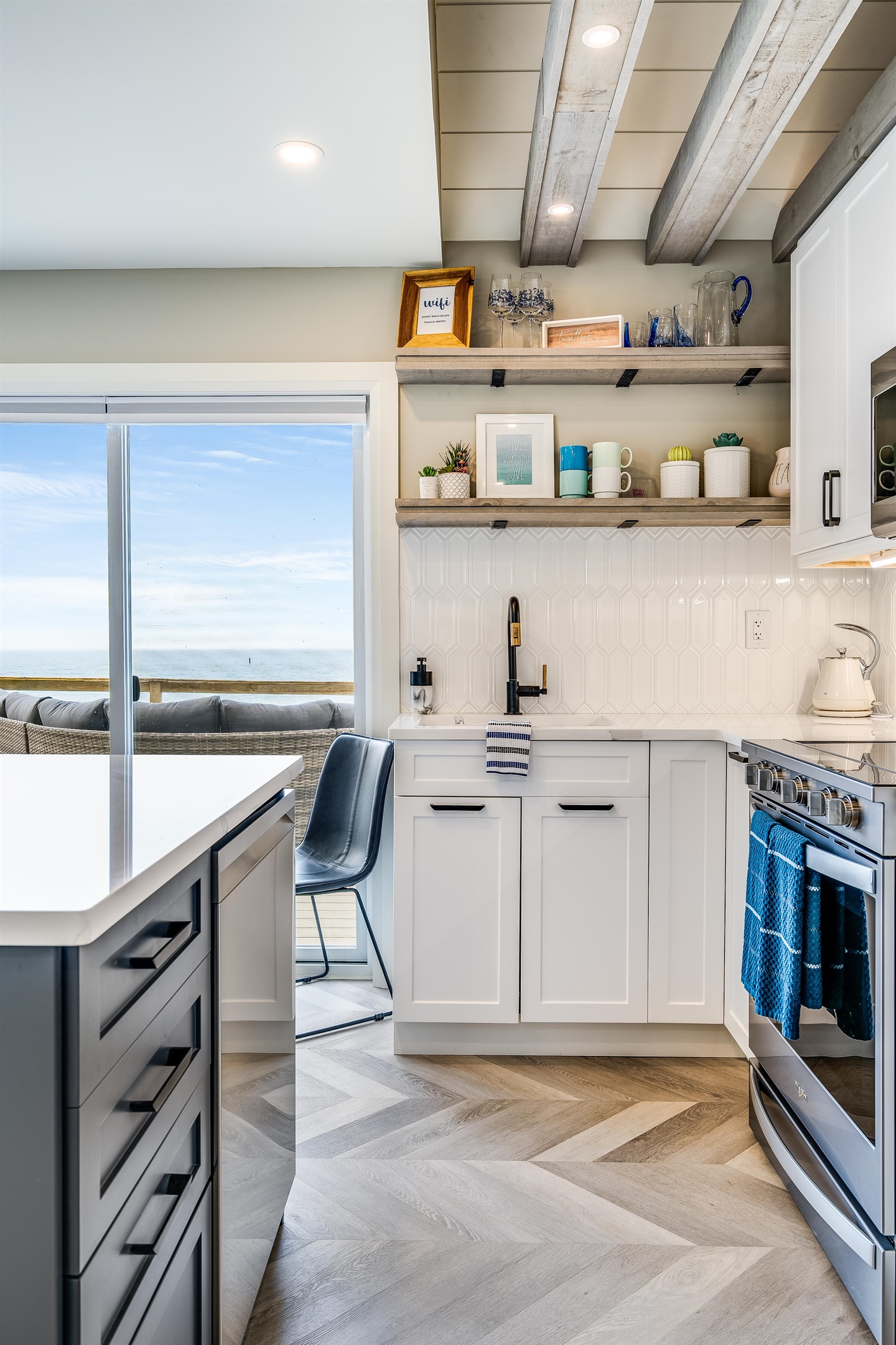 Fully equipped kitchen with stainless steel dishwasher and electric stove/oven combo.