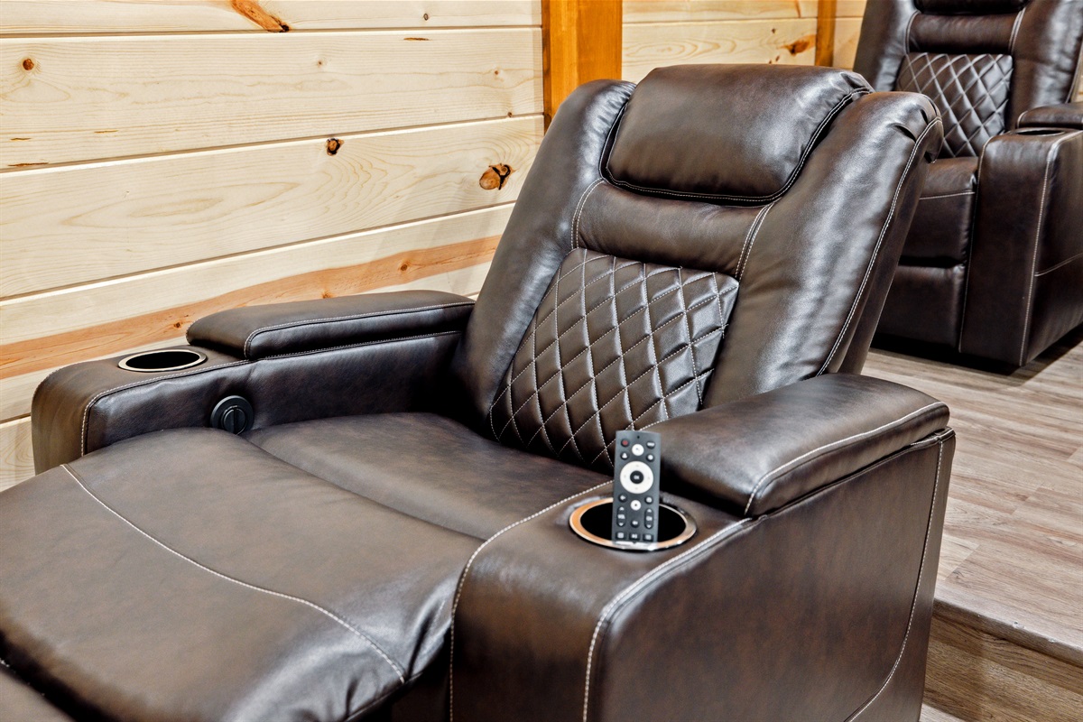 Private theater room with reclining cinema-style seating