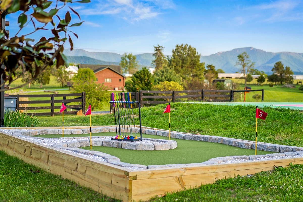 Tee off between hikes! The backyard minigolf course keeps the fun going between meals, movies, and mountain adventures.