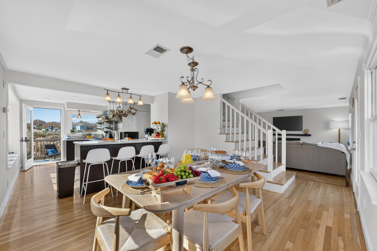 Spacious dining area flows seamlessly into the kitchen and living spaces for easy group gatherings.