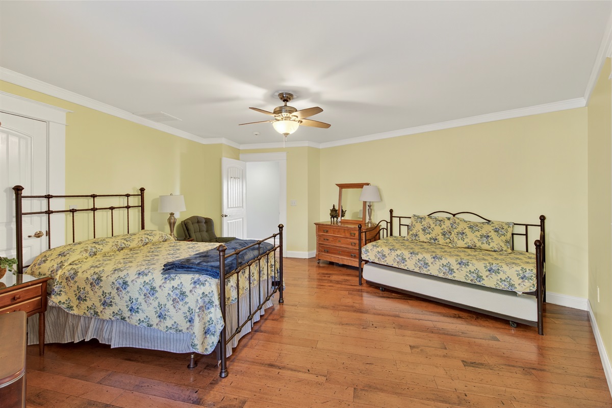 Oversized guest bedroom with plenty of space for everyone to spread out.