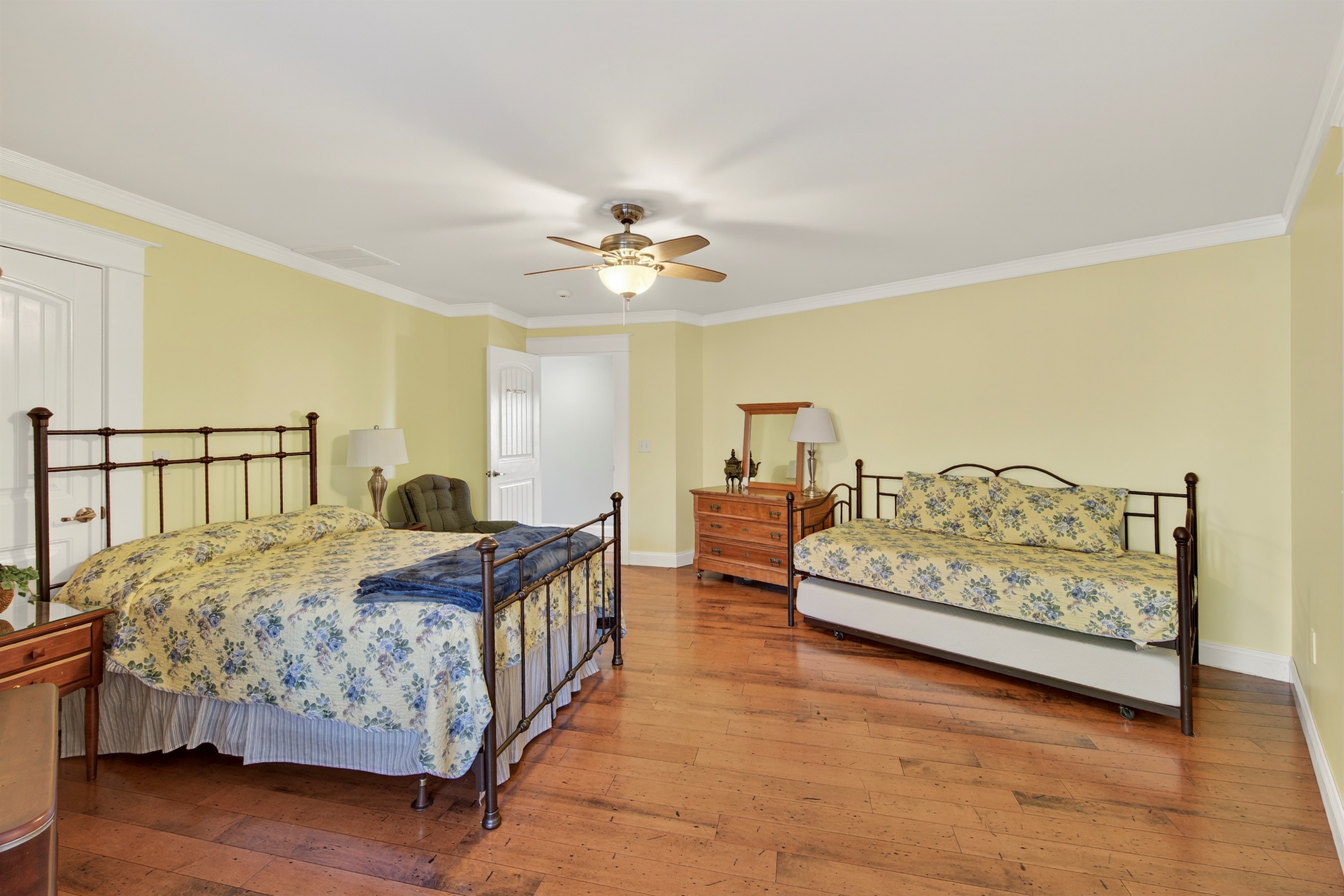 Oversized guest bedroom with plenty of space for everyone to spread out.