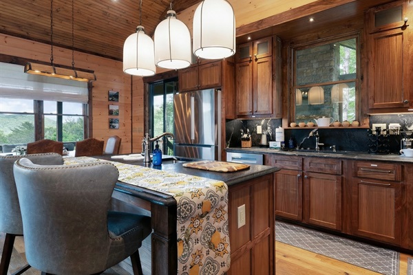 Gather around the kitchen island, a great spot for casual meals and conversations.