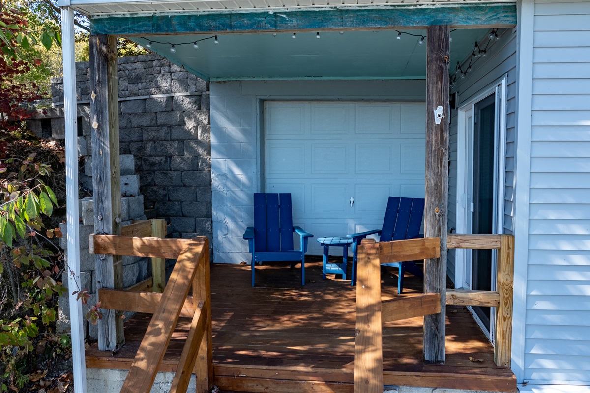 Relax on the covered porch with cozy seating and lake breezes — the ideal spot to unwind after a day on the water.