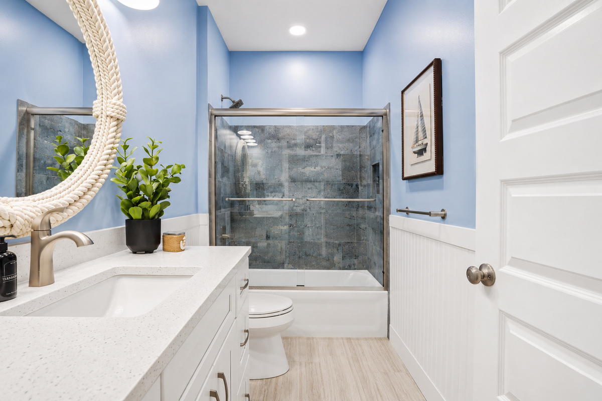 Freshen up in this bright and beautifully designed first-floor full bathroom, featuring a spacious tub and shower combination, modern finishes, and plenty of room to start or end your day in comfort.