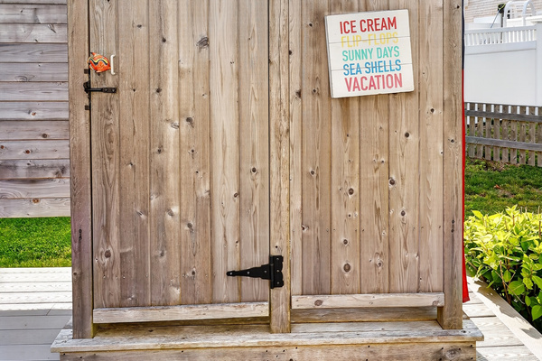 Private enclosed outdoor shower—perfect for rinsing off after the beach while keeping sand outside.