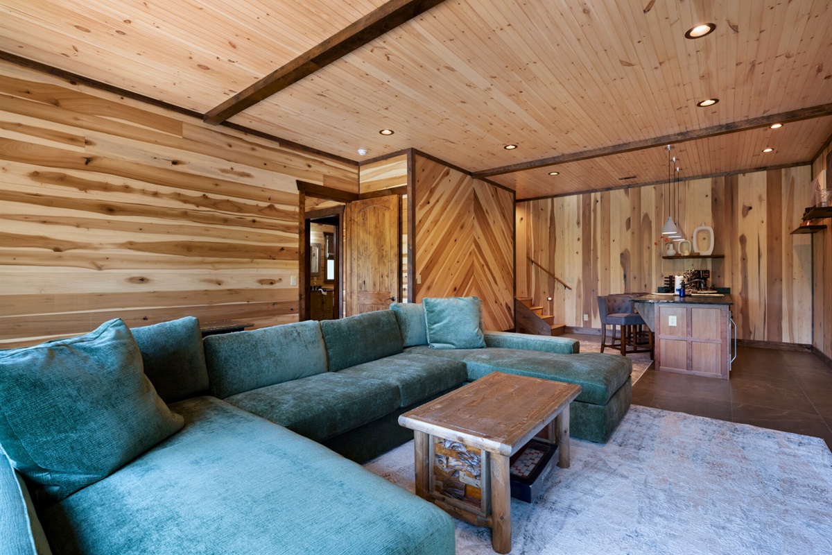 Unwind on the plush sofa in this spacious lounge area, perfect for movie nights or lazy afternoons.