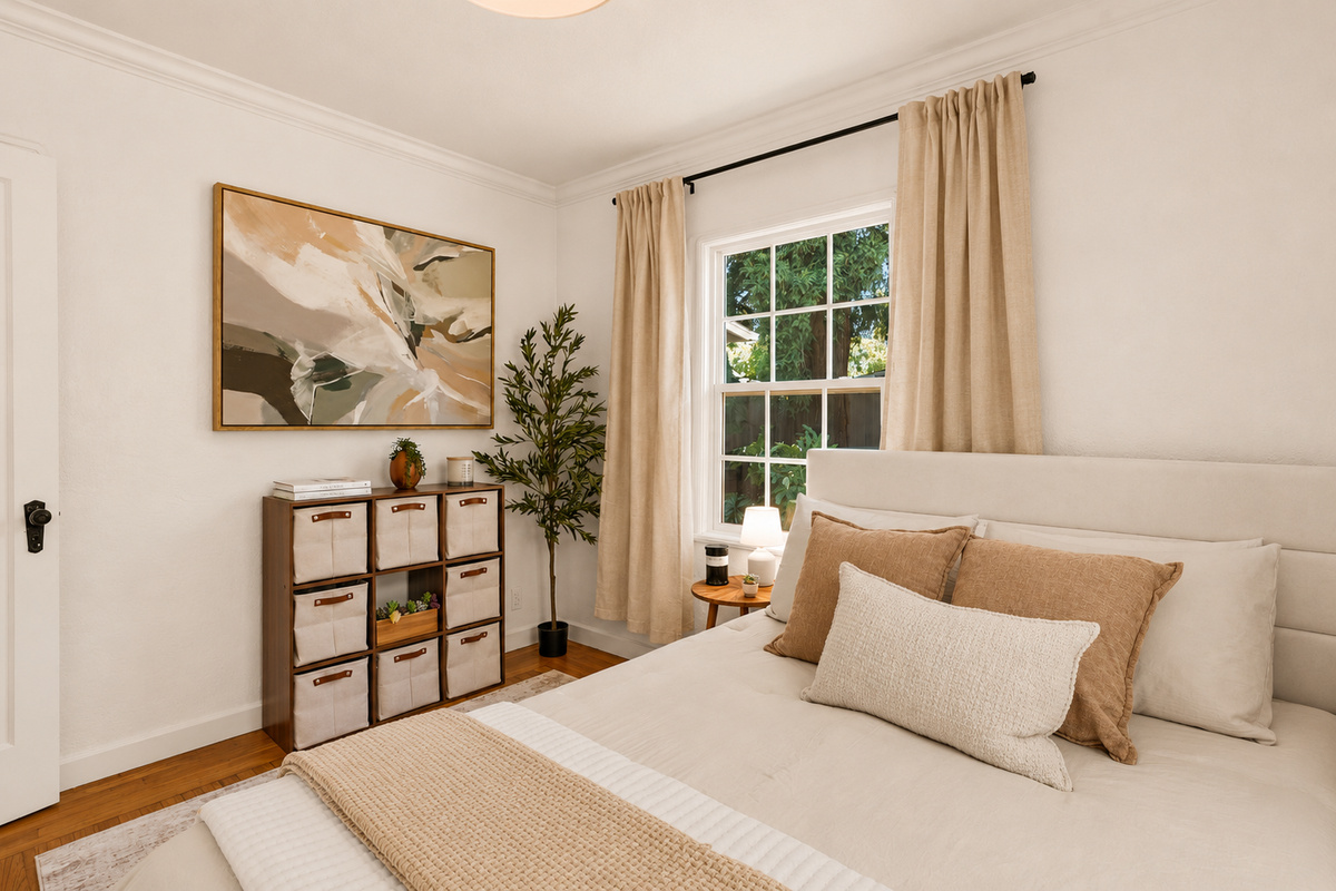 Bedroom 2 offers a cozy queen bed, soft bedding, natural light, and a peaceful atmosphere for a restful night’s sleep.