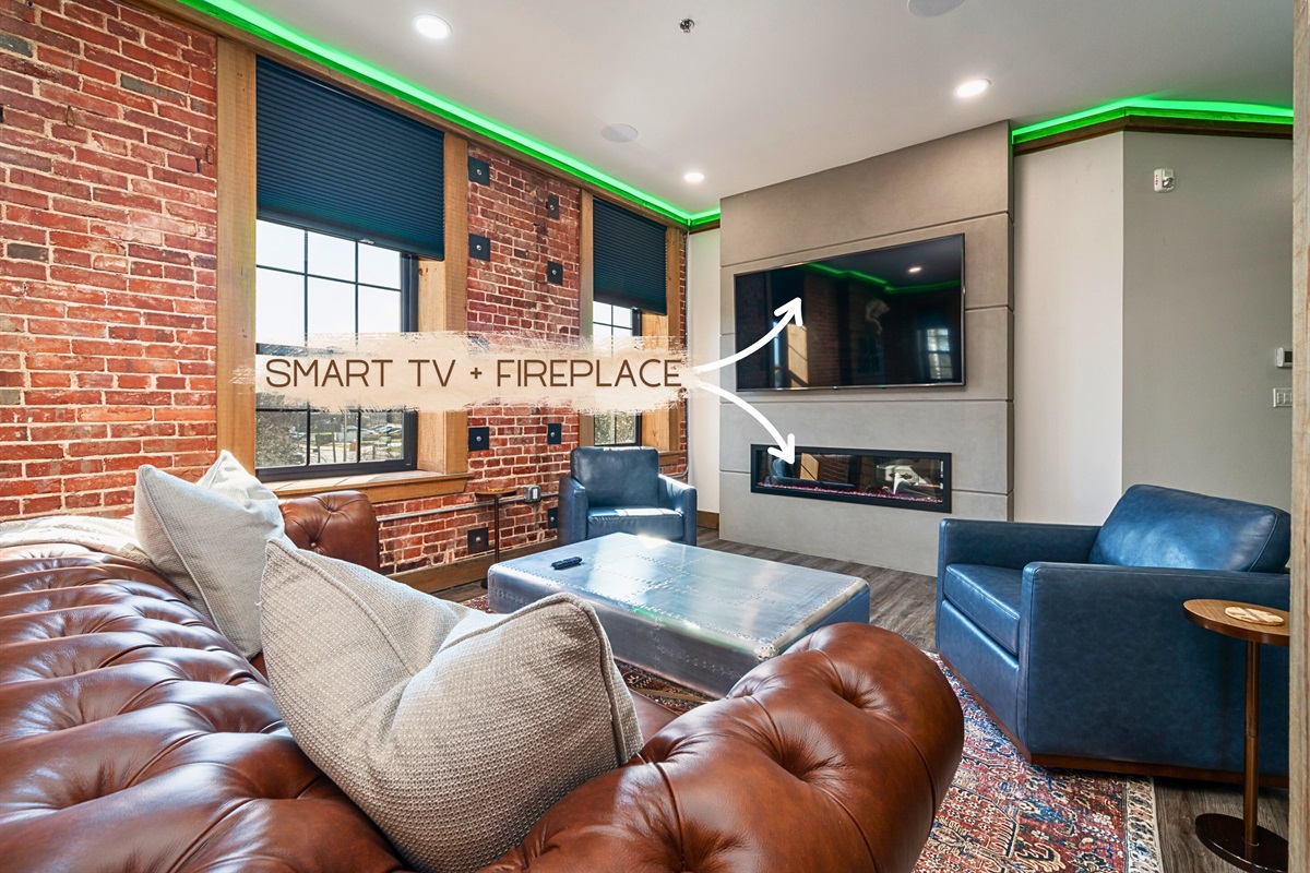 [Fireplace] Cozy Living Room with a Gas Fireplace and an Abundance of Lighting