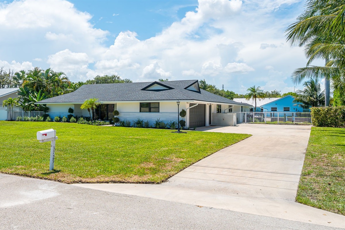 Welcome to this beautifully designed home with fresh landscaping and inviting curb appeal. The expansive driveway provides parking for up to three cars, making it ideal for families and groups. Located in a safe, family-friendly neighborhood