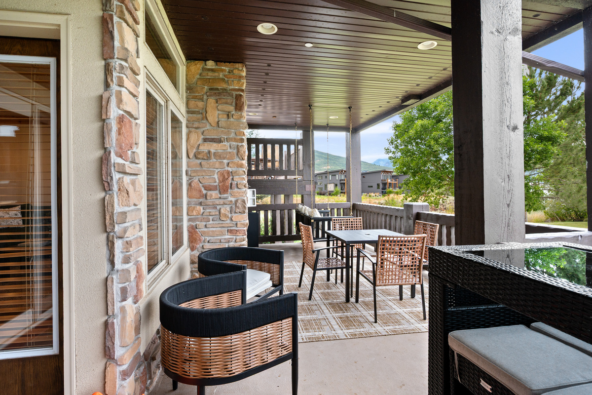 Covered outdoor living space lets you enjoy the fresh mountain air and lake scenery throughout your stay.