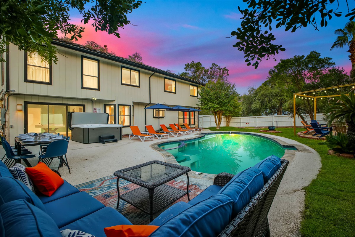 Relax in comfortable outdoor seating with views of the pool and backyard. Plenty of seating for your whole group to unwind and connect outdoors.