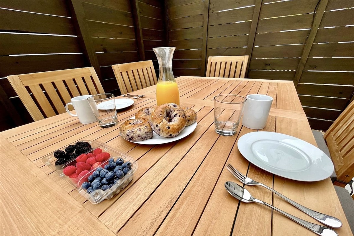 Private patio with outdoor table seating -- a perfect spot to sip your morning coffee or unwind with evening drinks while enjoying fresh coastal air.