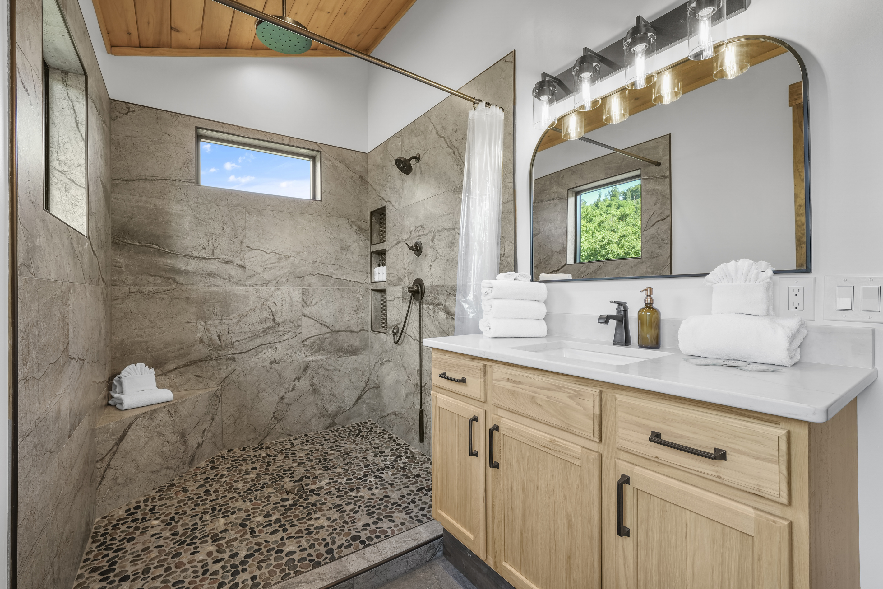 Enjoy the luxurious spa-style shower with a rain, hand & full shower head for the perfect start or end to your day. Plush towels & premium sulfate / paraben free shampoo, conditioner & body wash are provided.