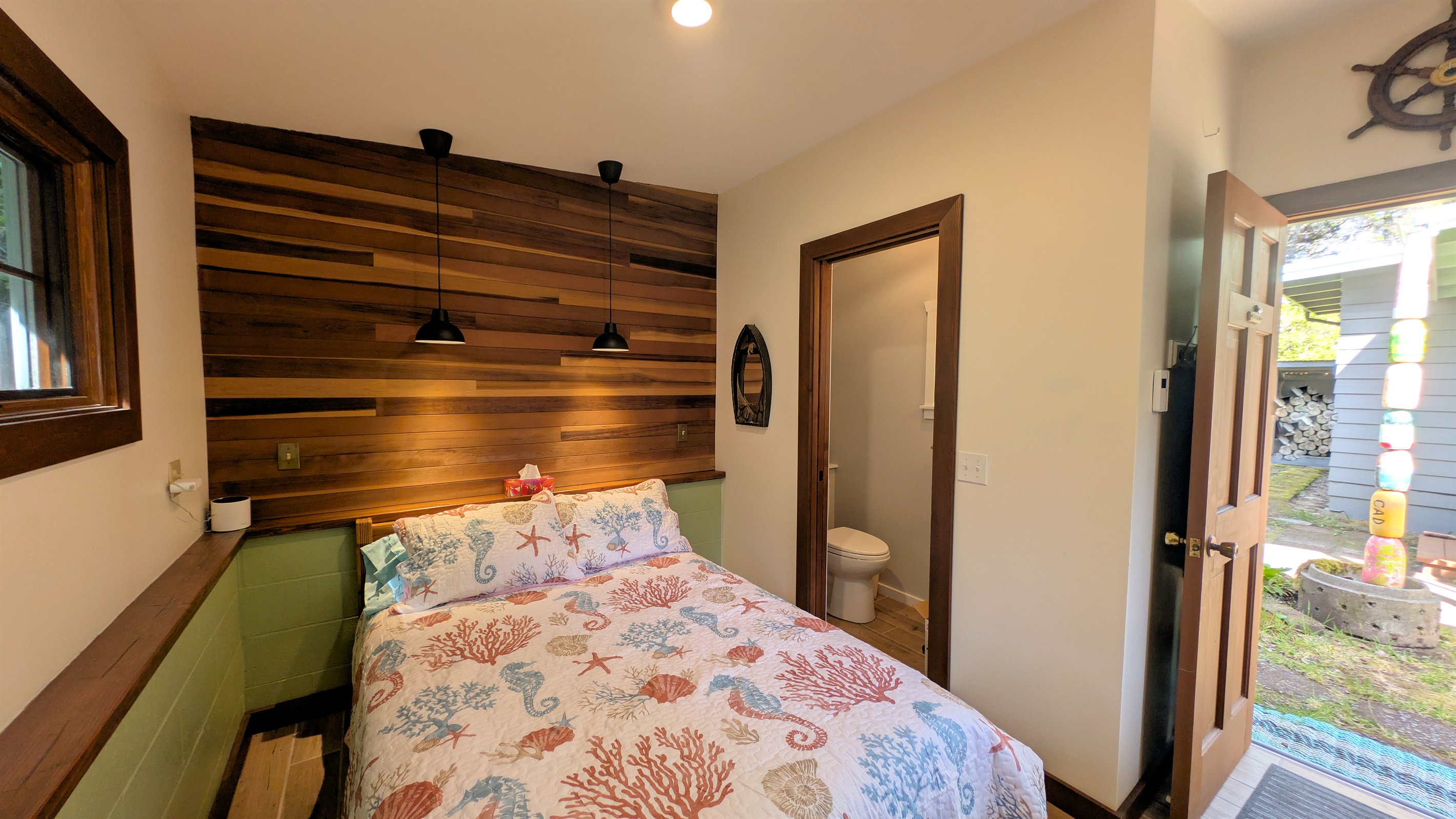 full size bed in bunkhouse with attached bath