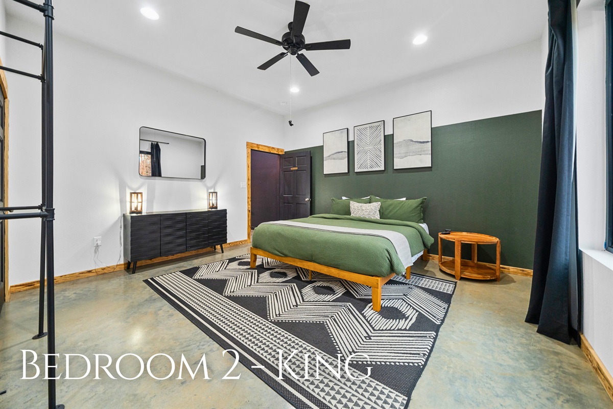Bedroom 2 offers another inviting king bed, soft lighting, and a calming color palette that makes settling in effortless.