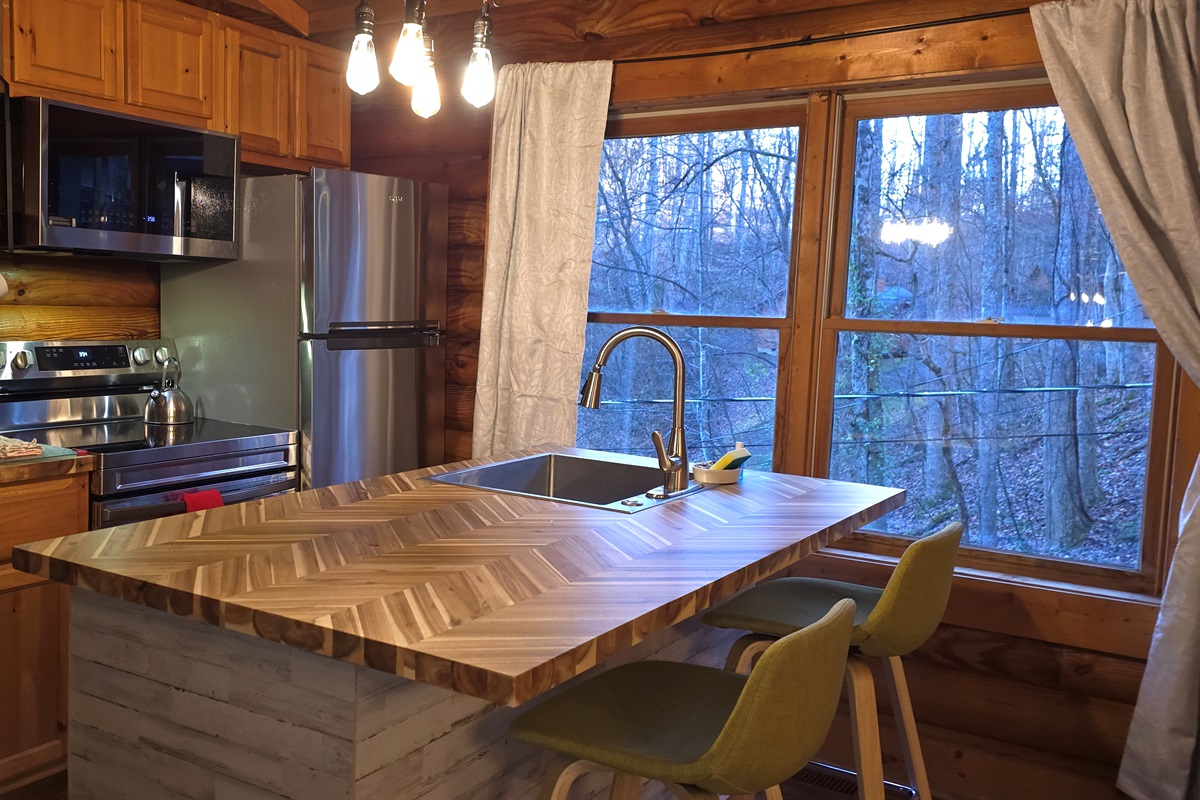 Floor-to-ceiling windows bring the outside in while you sip, stir, or serve something delicious.