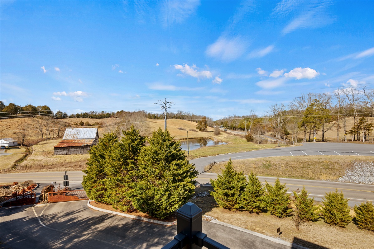 Scenic views from the property showcase the quiet surroundings and peaceful atmosphere of the gated community.