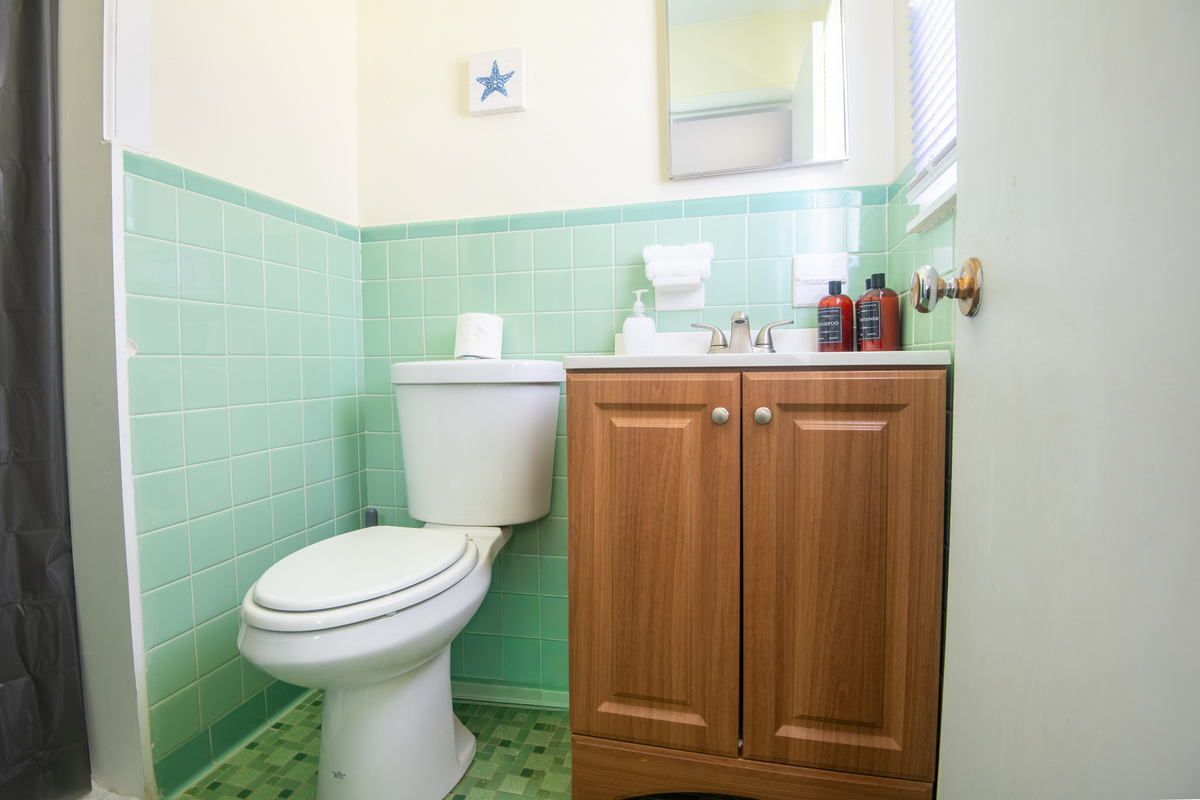 Connected to the King/Full suite, the second bathroom gives everyone a little extra space to get ready. With plenty of counter space and storage below, it's easy to spread out during busy mornings.