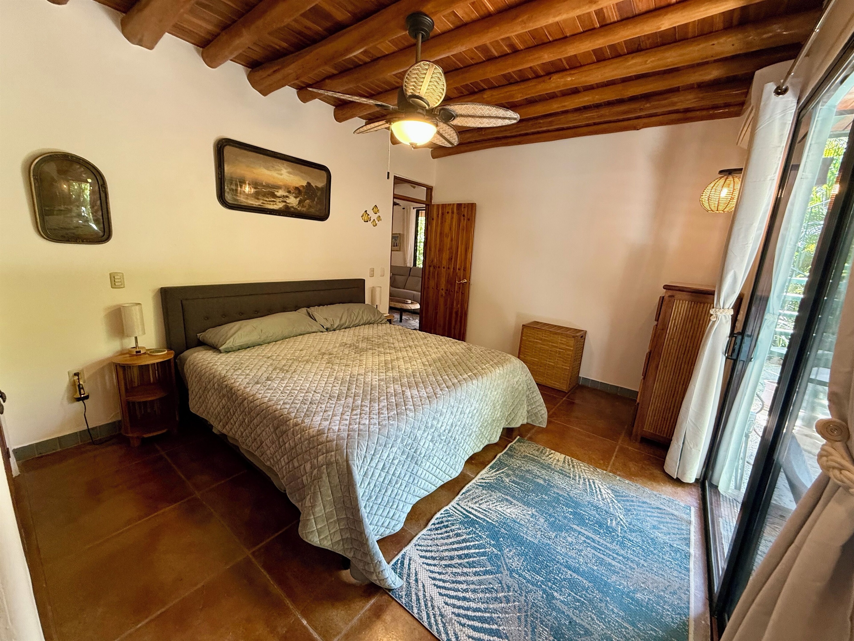 Bedroom 1- king bed with private patio 