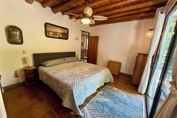 Bedroom 1- king bed with private patio 