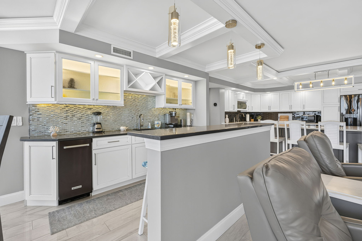 Beautiful open layout with the wet bar, kitchen and living room all overlooking the ocean