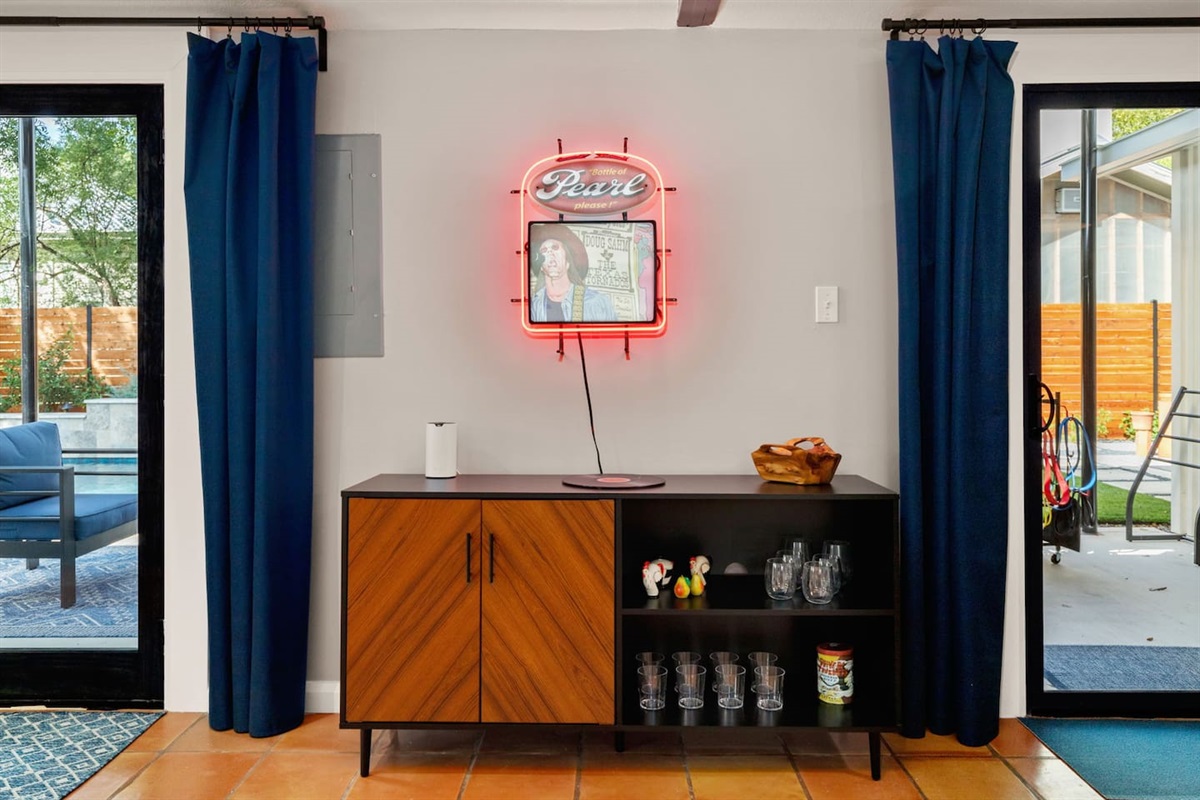 Living area: Love seat, couch, and 50 inch Smart TV with DVD player