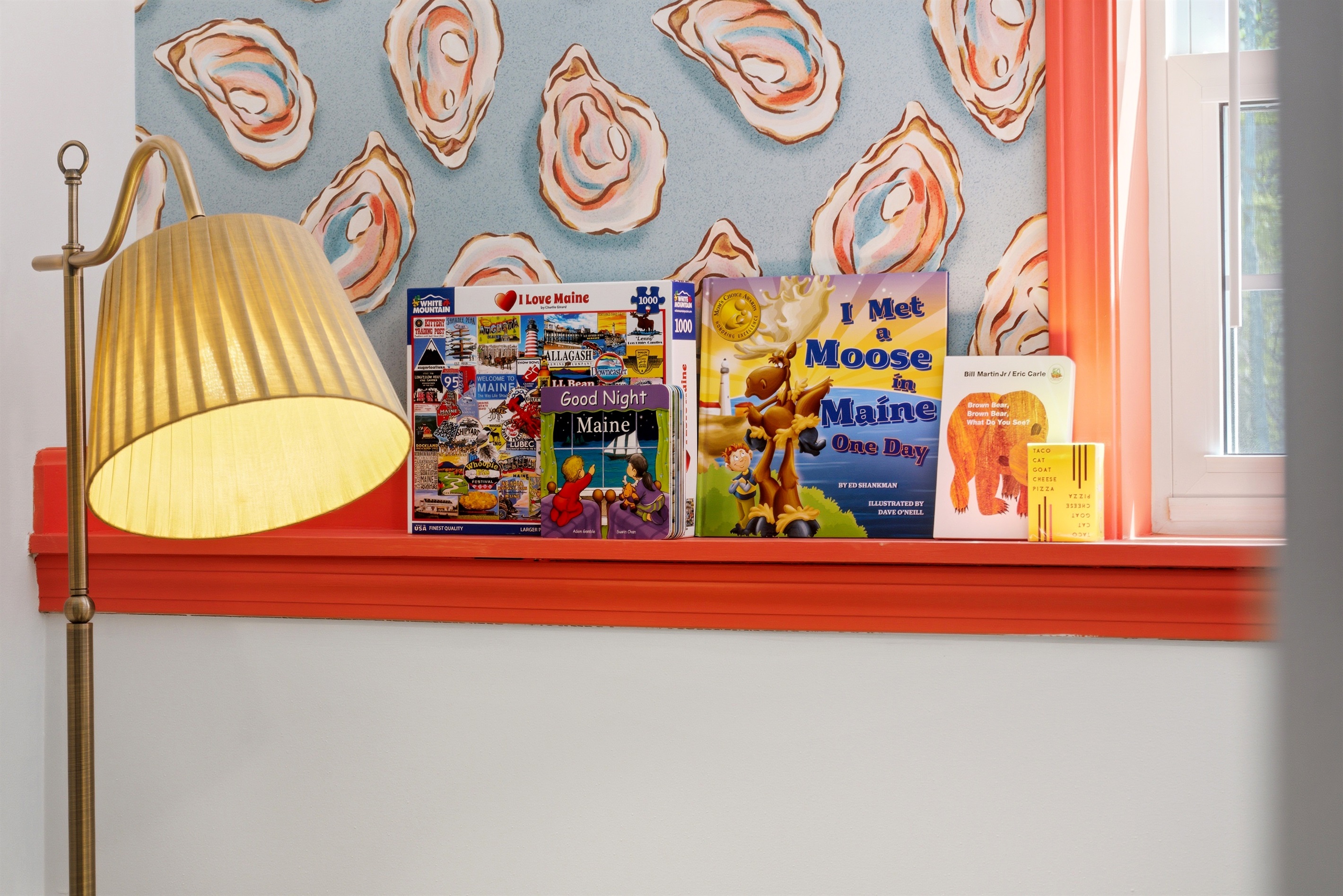 Books and board games, creating a warm and inviting space for relaxation, reading, and shared fun.