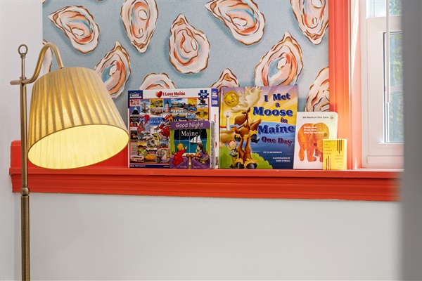 Books and board games, creating a warm and inviting space for relaxation, reading, and shared fun.