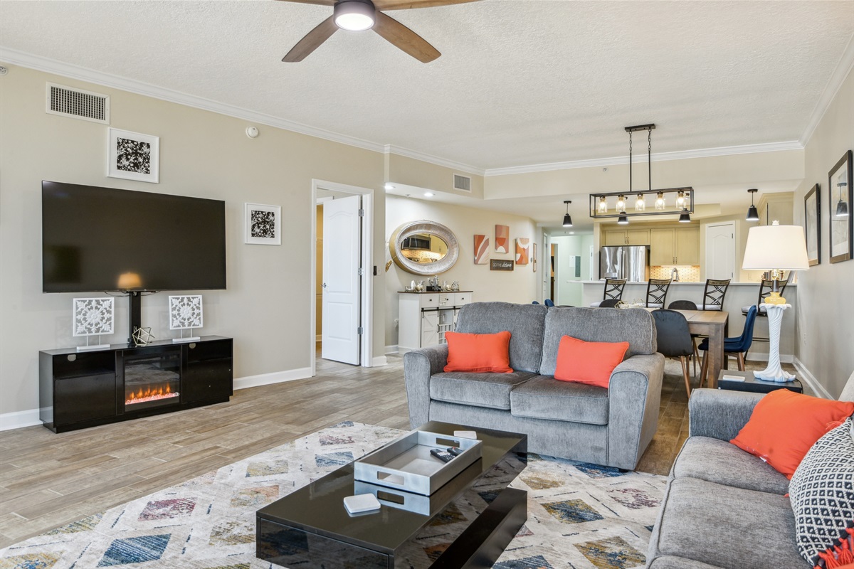 Living room looking towards dining, kitchen, front door.